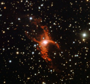 This image shows an example of a bipolar planetary nebula known as NGC 6537 taken with the New Technology Telescope at ESO’s La Silla Observatory. The shape, reminiscent of a butterfly or an hourglass, was formed as a Sun-like star approached the end of its life and puffed its outer layers into the surrounding space. For bipolar nebulae, this material is funnelled towards the poles of the ageing star, creating the distinctive double-lobed structure. Observations using the NTT and Hubble have found that bipolar planetary nebulae located towards the central bulge of our Milky Way appear to be strangely aligned in the sky  — a surprising result given their varied and chaotic formation. NGC 6537, which lies much closer to the Earth, was not part of the new study.