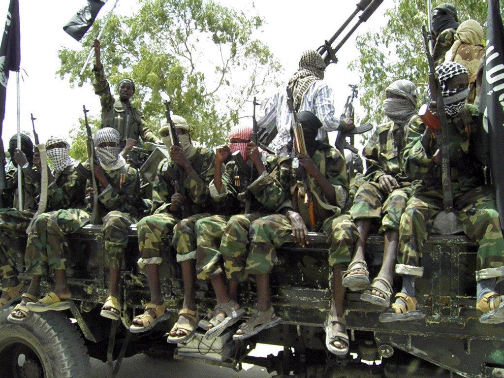 In this photo of Thursaday, Oct.21, 2010,  Al-Shabaab fighters display weopons as they conduct military exercises in northern Mogadishu, Somalia A failed offensive by Somalia's strongest insurgent group has left at least 20 people dead as the Islamist group attempted to recapture a district in southwestern Somalia from government forces, an official and a witness said Friday.   The attempt by al-Shabab, an al-Qaida-linked Somali militia, to win back a district near Kenya's border left 12 people injured, said local resident Osman Gelle. Gelle said the violence, which started Thursday afternoon, was the worst he had seen in more than a year.   Somali government forces took over the Beled-Hawa district last Sunday in an offensive launched to take back areas held by militants. Al-Shabab militants took control of the area in Jan. 2009 after Ethiopian troops, who had entered to support Somalia's transitional government, withdrew from Somalia. The militia group briefly lost control of the town in Aug. 2009 to Ahlu Sunna Waljamea, a moderate Islamist group allied to the government. (AP Photo/Mohamed Sheikh Nor)